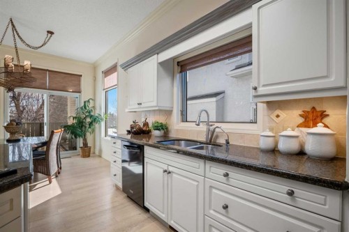 60 Woodpark Close Sw, Calgary, AB - Indoor Photo Showing Kitchen With Double Sink
