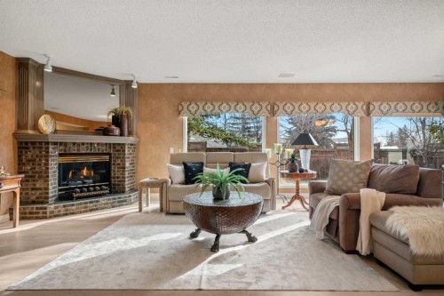 60 Woodpark Close Sw, Calgary, AB - Indoor Photo Showing Living Room With Fireplace