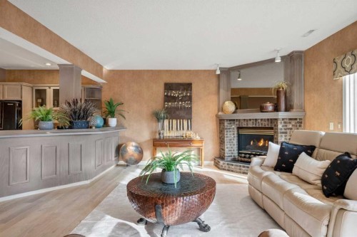 60 Woodpark Close Sw, Calgary, AB - Indoor Photo Showing Living Room With Fireplace