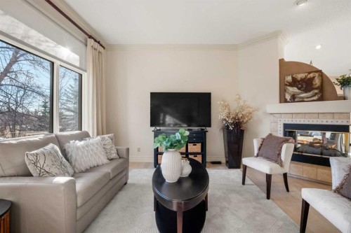 60 Woodpark Close Sw, Calgary, AB - Indoor Photo Showing Living Room With Fireplace