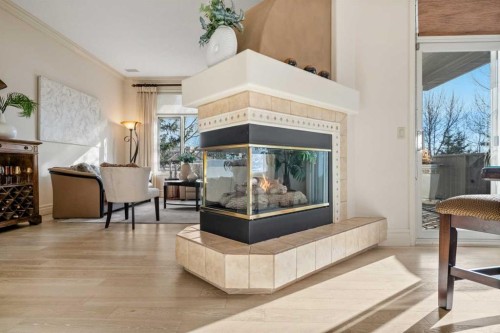 60 Woodpark Close Sw, Calgary, AB - Indoor Photo Showing Other Room With Fireplace