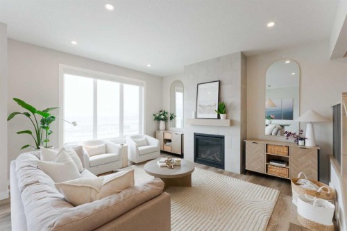 156 Precedence View, Cochrane, AB - Indoor Photo Showing Living Room With Fireplace