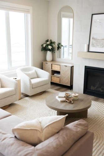 156 Precedence View, Cochrane, AB - Indoor Photo Showing Living Room With Fireplace