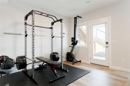 156 Precedence View, Cochrane, AB - Indoor Photo Showing Gym Room