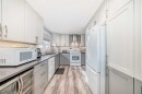 52A Queen Alexandra Close Se, Calgary, AB  - Indoor Photo Showing Kitchen 