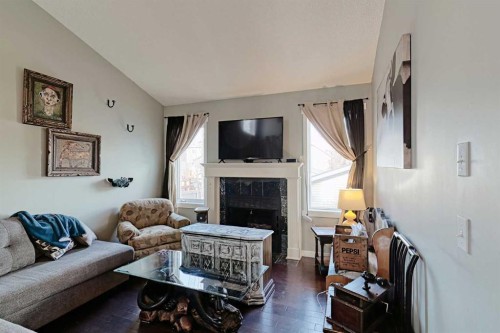 210 Mt Lorette Close Se, Calgary, AB - Indoor Photo Showing Living Room With Fireplace