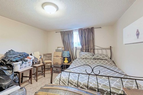 210 Mt Lorette Close Se, Calgary, AB - Indoor Photo Showing Bedroom