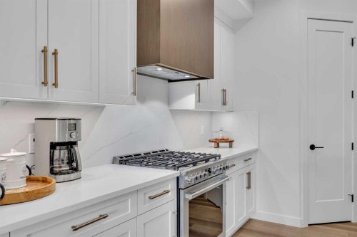 13 Emerson Crescent, Okotoks, AB - Indoor Photo Showing Kitchen With Upgraded Kitchen