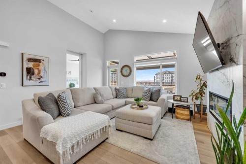 13 Emerson Crescent, Okotoks, AB - Indoor Photo Showing Living Room With Fireplace