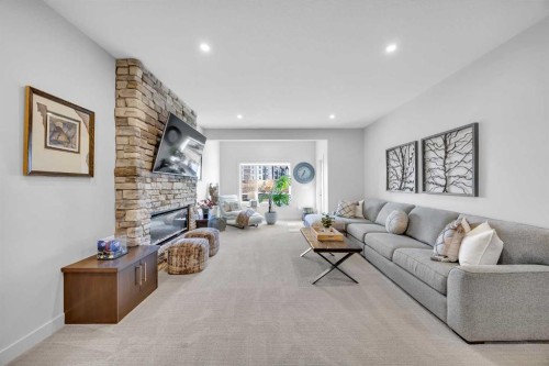 13 Emerson Crescent, Okotoks, AB - Indoor Photo Showing Living Room With Fireplace