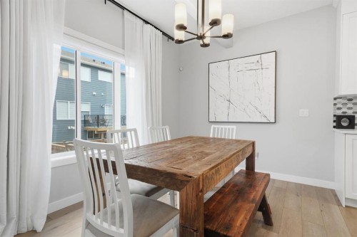 902 Bluerock Way Sw, Calgary, AB - Indoor Photo Showing Dining Room