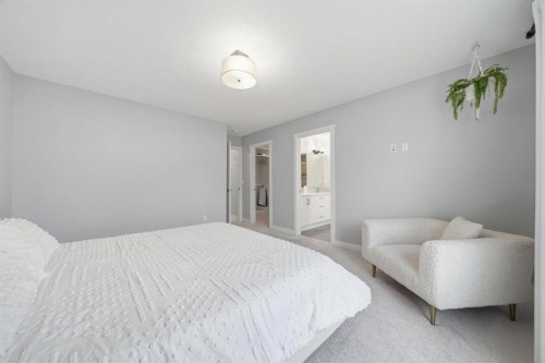 902 Bluerock Way Sw, Calgary, AB - Indoor Photo Showing Bedroom