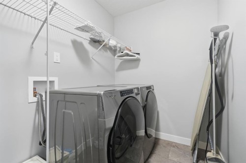 902 Bluerock Way Sw, Calgary, AB - Indoor Photo Showing Laundry Room