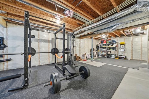 902 Bluerock Way Sw, Calgary, AB - Indoor Photo Showing Basement
