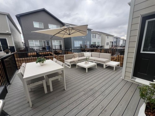 902 Bluerock Way Sw, Calgary, AB - Outdoor With Deck Patio Veranda With Exterior