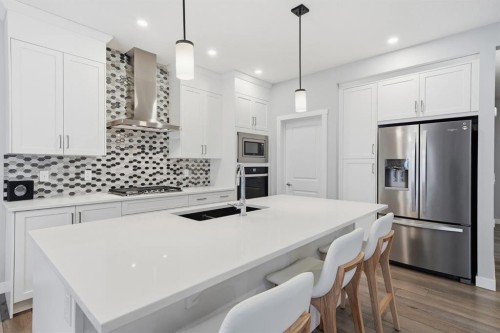 902 Bluerock Way Sw, Calgary, AB - Indoor Photo Showing Kitchen With Upgraded Kitchen