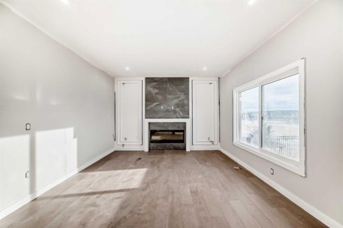 524 Heritage Boulevard, Cochrane, AB - Indoor With Fireplace
