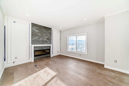 524 Heritage Boulevard, Cochrane, AB - Indoor Photo Showing Living Room With Fireplace