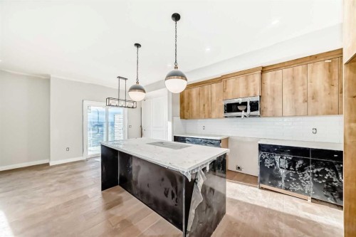 524 Heritage Boulevard, Cochrane, AB - Indoor Photo Showing Kitchen