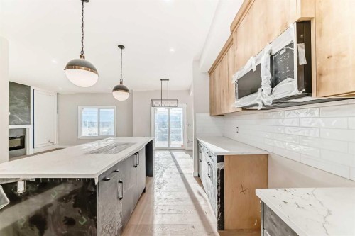 524 Heritage Boulevard, Cochrane, AB - Indoor Photo Showing Kitchen