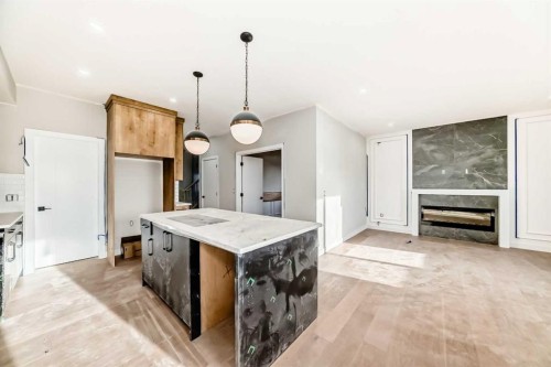 524 Heritage Boulevard, Cochrane, AB - Indoor Photo Showing Other Room With Fireplace