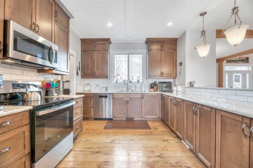 23 Winters Place, Rural Rocky View County, AB - Indoor Photo Showing Kitchen With Upgraded Kitchen