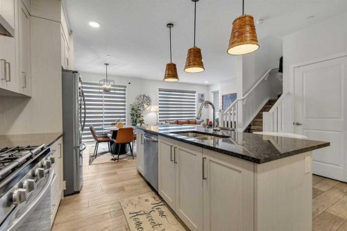260 Lucas Way Nw, Calgary, AB - Indoor Photo Showing Kitchen With Double Sink With Upgraded Kitchen