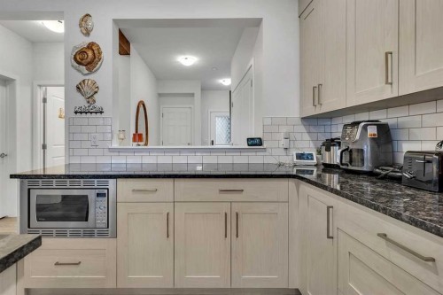 260 Lucas Way Nw, Calgary, AB - Indoor Photo Showing Kitchen With Upgraded Kitchen