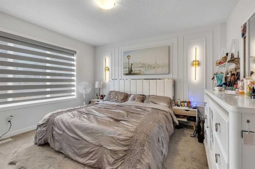 260 Lucas Way Nw, Calgary, AB - Indoor Photo Showing Bedroom