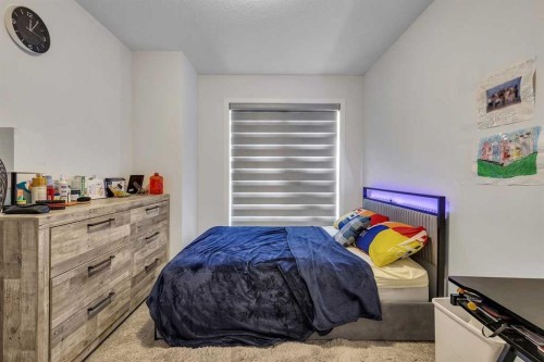 260 Lucas Way Nw, Calgary, AB - Indoor Photo Showing Bedroom