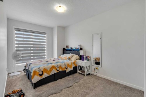 260 Lucas Way Nw, Calgary, AB - Indoor Photo Showing Bedroom