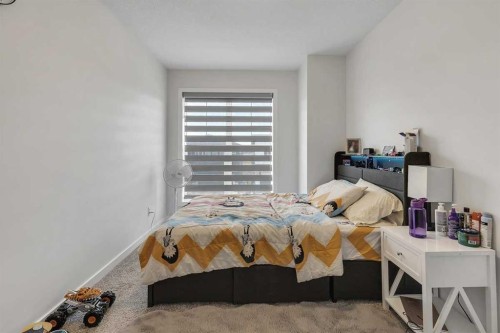 260 Lucas Way Nw, Calgary, AB - Indoor Photo Showing Bedroom
