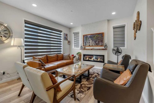 260 Lucas Way Nw, Calgary, AB - Indoor Photo Showing Living Room With Fireplace