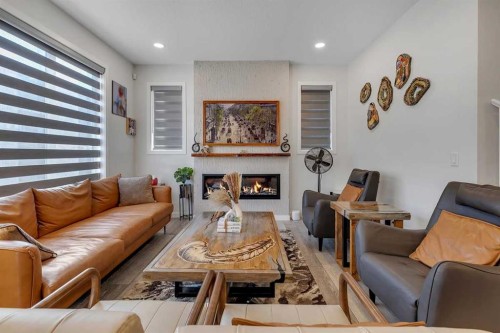 260 Lucas Way Nw, Calgary, AB - Indoor Photo Showing Living Room With Fireplace