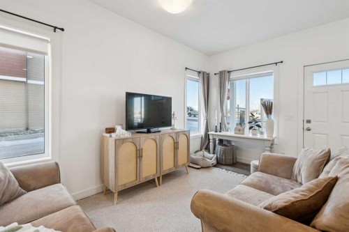 101-24 Rivercrest Drive, Cochrane, AB - Indoor Photo Showing Living Room