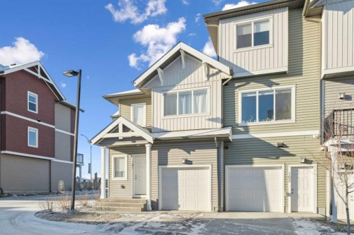 101-24 Rivercrest Drive, Cochrane, AB - Outdoor With Facade