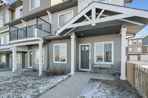 101-24 Rivercrest Drive, Cochrane, AB - Outdoor With Facade