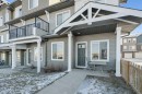 101-24 Rivercrest Drive, Cochrane, AB  - Outdoor With Facade 
