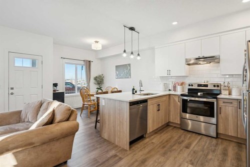 101-24 Rivercrest Drive, Cochrane, AB - Indoor Photo Showing Kitchen With Stainless Steel Kitchen With Upgraded Kitchen