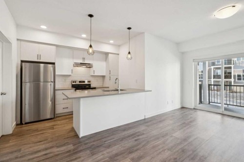903-24 Rivercrest Drive, Cochrane, AB - Indoor Photo Showing Kitchen With Stainless Steel Kitchen With Double Sink With Upgraded Kitchen
