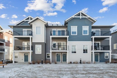 903-24 Rivercrest Drive, Cochrane, AB - Outdoor With Facade