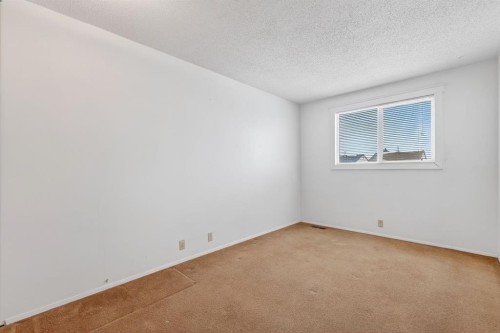 115 Abingdon Court Ne, Calgary, AB - Indoor Photo Showing Other Room