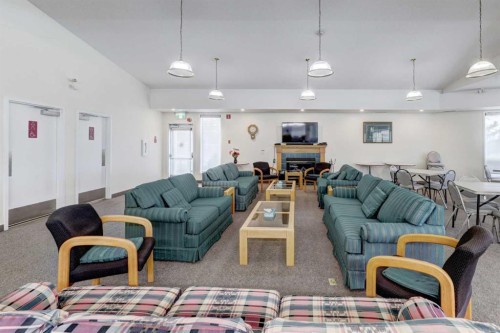 309-3309 Hawksbrow Point Nw, Calgary, AB - Indoor Photo Showing Living Room