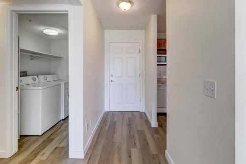 309-3309 Hawksbrow Point Nw, Calgary, AB - Indoor Photo Showing Laundry Room