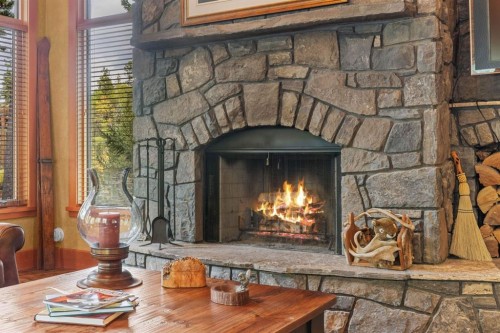 163 Cairns Landing, Canmore, AB - Indoor Photo Showing Living Room With Fireplace