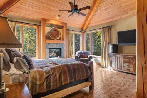 163 Cairns Landing, Canmore, AB - Indoor Photo Showing Other Room With Fireplace