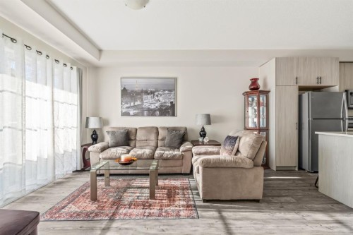 6302-151 Legacy Main Street Se, Calgary, AB - Indoor Photo Showing Living Room