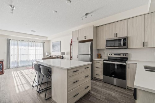 6302-151 Legacy Main Street Se, Calgary, AB - Indoor Photo Showing Kitchen With Stainless Steel Kitchen With Upgraded Kitchen
