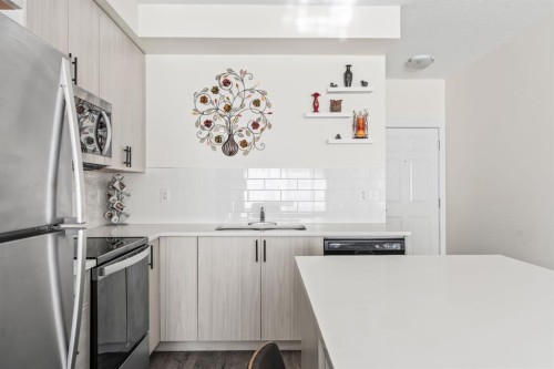6302-151 Legacy Main Street Se, Calgary, AB - Indoor Photo Showing Kitchen With Stainless Steel Kitchen With Upgraded Kitchen