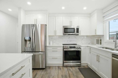 3 Kentish Drive Sw, Calgary, AB - Indoor Photo Showing Kitchen With Stainless Steel Kitchen With Double Sink With Upgraded Kitchen